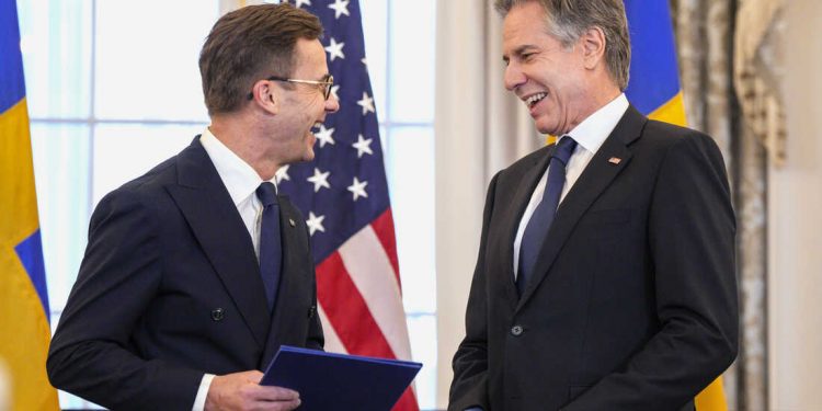 Secretary of State Antony Blinken, right, stands with Swedish Prime Minister Ulf Kristersson before presenting Sweden's NATO Instruments of Accession in the Benjamin Franklin Room at the State Department, Thursday, March 7, 2024, in Washington. (AP Photo/Jess Rapfogel)