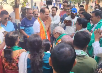 Rival party leaders greet each other during election campaigning