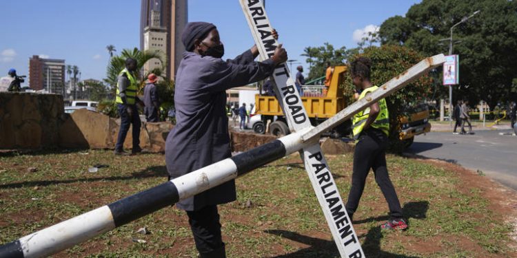 Amid heavy police presence, Kenya starts clearing debris after protests in which at least six died