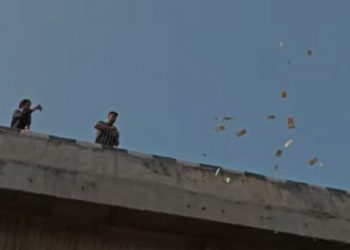 Man throws cash