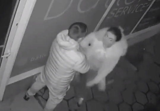 Viral CCTV footage: Woman loses her head, literally! She smashes through storefront mid-fight