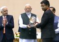 V Keerthi Vasan receiving the award from PM Narendra Modi