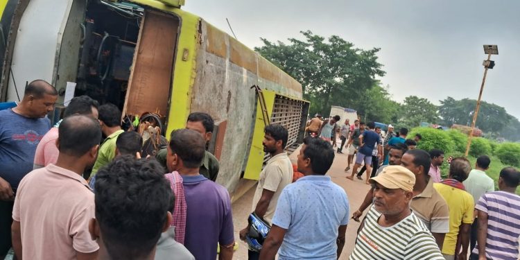 Bus overturns