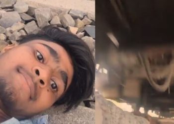 'Look at this idiot'_Viral video shows man risking life under moving train for likes
