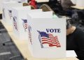 TOPSHOT - People cast their ballots on the last day of early voting for the general election in Michigan at the Livingston Educational Service Agency in Howell, Michigan on November 3, 2024. (Photo by JEFF KOWALSKY / AFP) (Photo by JEFF KOWALSKY/AFP via Getty Images)