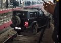 Man parked SUV on railway tracks