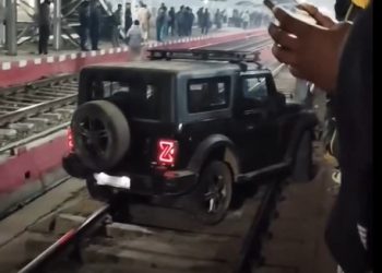 Man parked SUV on railway tracks