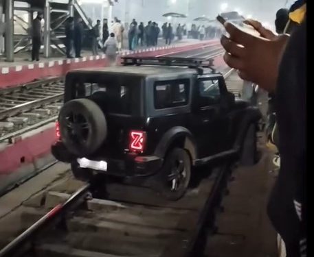Man parked SUV on railway tracks