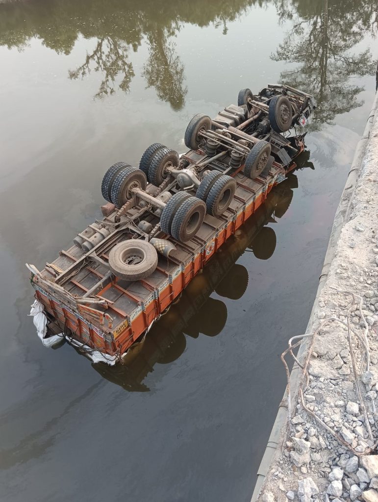 Rice-laden truck plunges into river