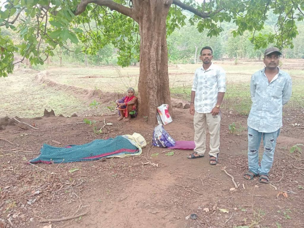 Helpless widow guards husband's body after being abandoned