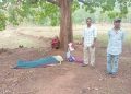 Helpless widow guards husband's body after being abandoned