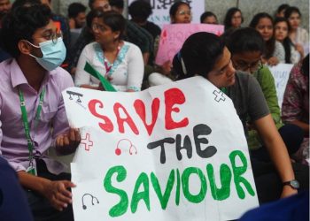 Behind the mask, doctors seek safety