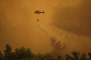Two firefighting helicopters collide while battling Greece wildfire